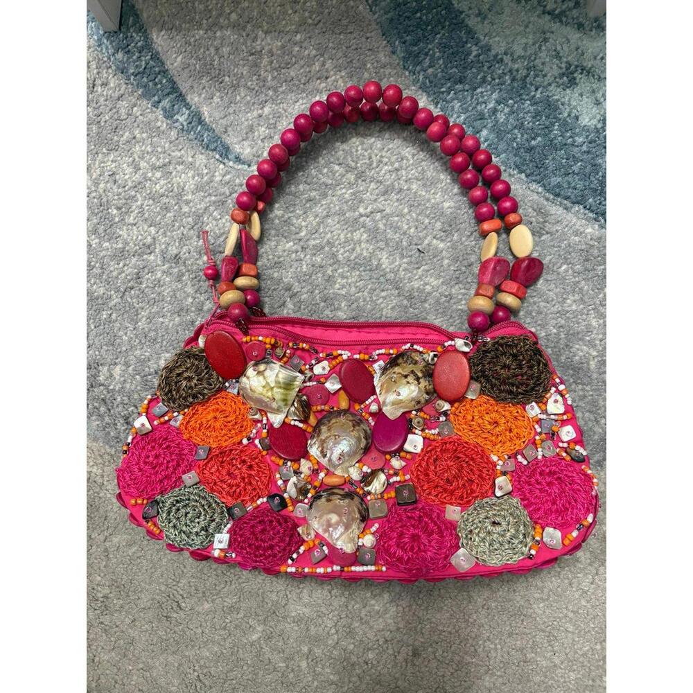 CEBU Signature Collection embellished shell handbag.